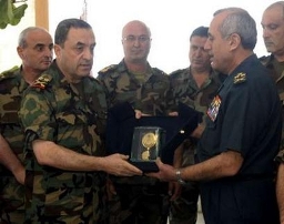 Lebanon's army Chief of staff Shawki al-Masri (L) decorates his chief commander Brigadier General Michel Suleiman with a medal during a farewell memorial in Yarzeh east of Beirut May 24, 2008. Suleiman, set to be elected Lebanon's president on Sunday, has kept the army unified through three years of turmoil that have taken the country to the brink of a new civil war. REUTERS/Lebanese Army Media office/Handout (LEBANON) Lebanon's army Chief of staff Shawki al-Masri (L) decorates his chief commander Brigadier General Michel Suleiman with a medal during a farewell memorial in Yarzeh east of Beirut May 24, 2008. Suleiman, set to be elected Lebanon's president on Sunday, has kept the army unified through three years of turmoil that have taken the country to the brink of a new civil war. REUTERS/Lebanese Army Media office/Handout (LEBANON)