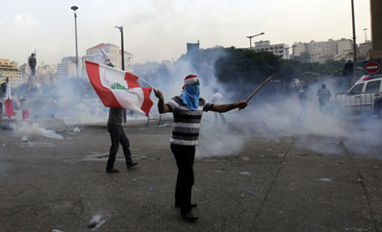 Lebanese protesters following the funeral of slain intelligence chief Wissam al-Hassan on Sunday. Many suspect Syria�s, and, by extension Iran�s, involvement with the killing. (AFP photo)