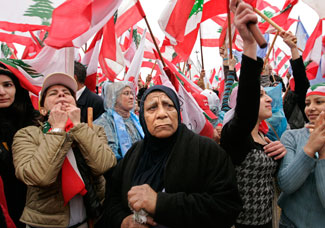Government supporters gathered in Beirut Feb. 14, 2008, to mark the third anniversary of Rafik Hariri's assassination. Syria is the chief suspect in the murder of Mr. Hariri, but the investigation may cause setbacks in peace overtures initiated by Syria. Tara Todras-Whitehill/AP 